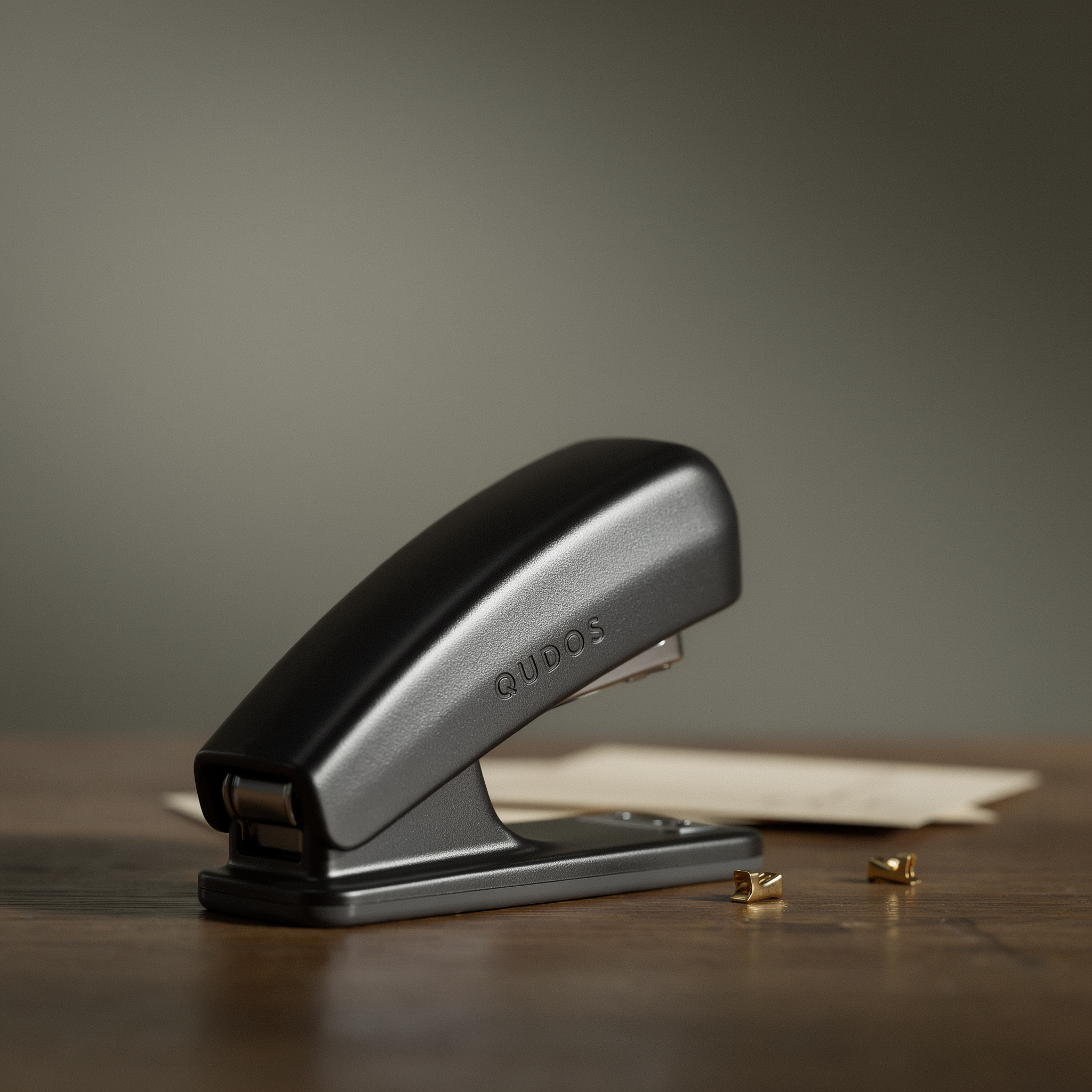 Qudos graphite desktop stapler with gold staples